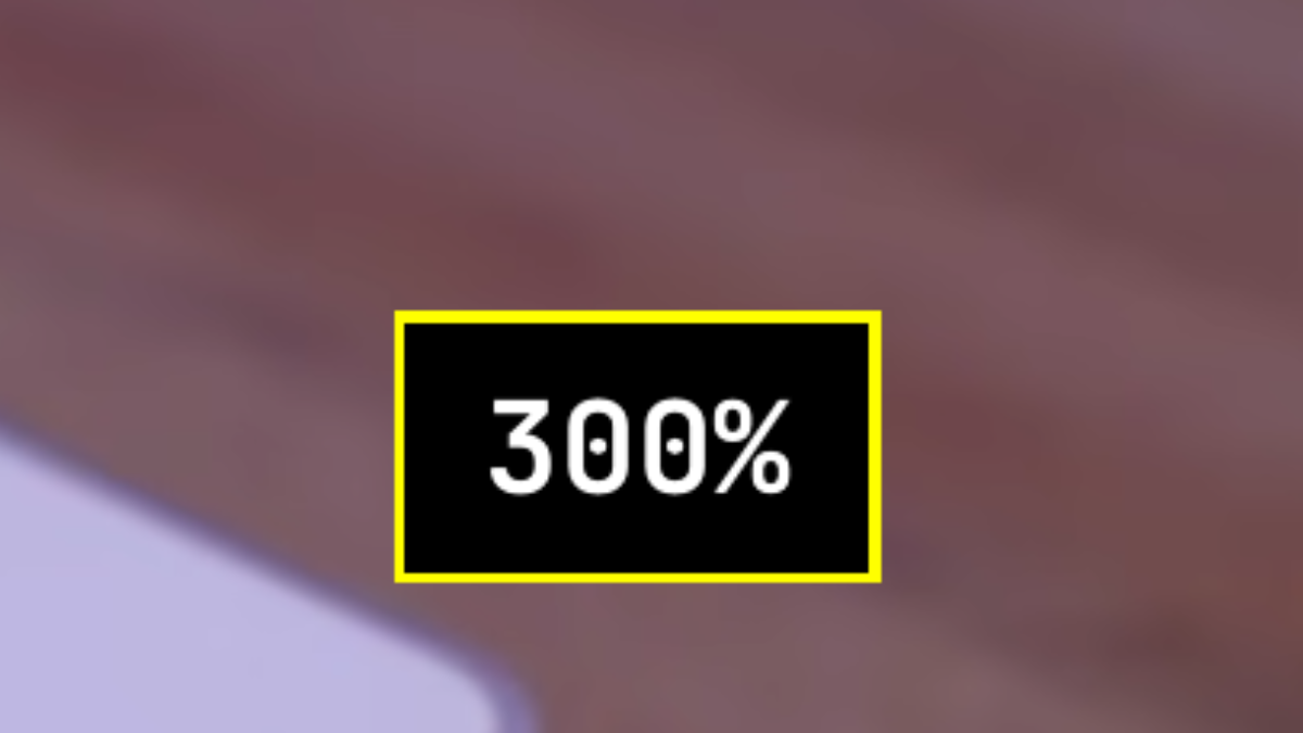 The Magnifier zoom popup: a black box with a thick yellow border and large white text reading 300%, shown over a magnified desktop background